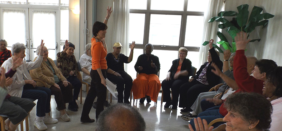 Laurie Peters and senior housing residents exercising