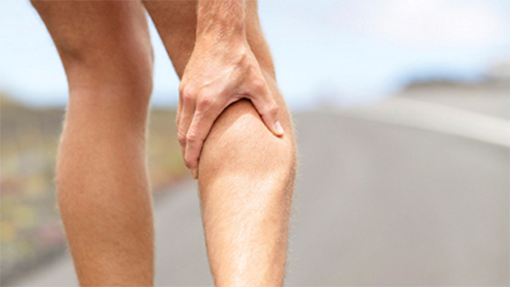 Man massaging the calf of his leg