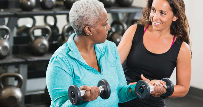 Older woman working out with weights
